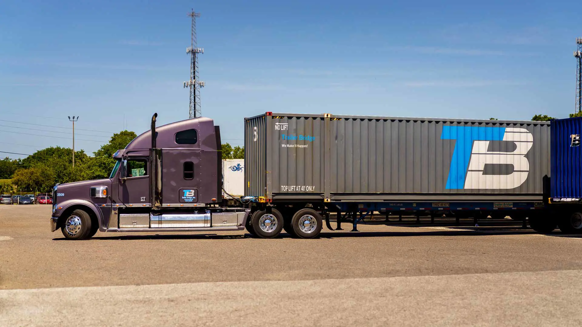A trailer truck with a Trailer Bridge container.