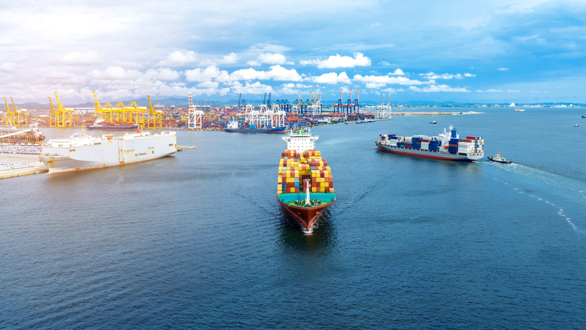 Cargo ships leaving and entering a port