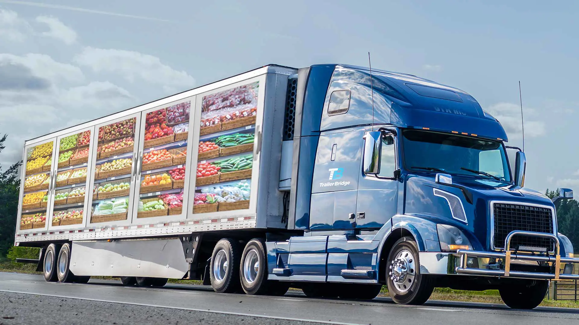 A Trailer Bridge semi-truck with a produce decal on the trailer.