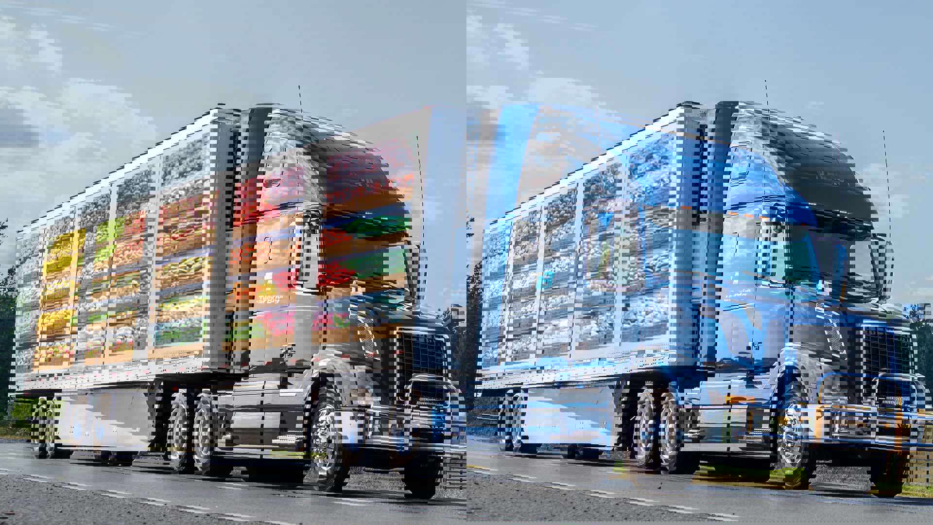 A Trailer Bridge semi-truck with a produce decal on the trailer.
