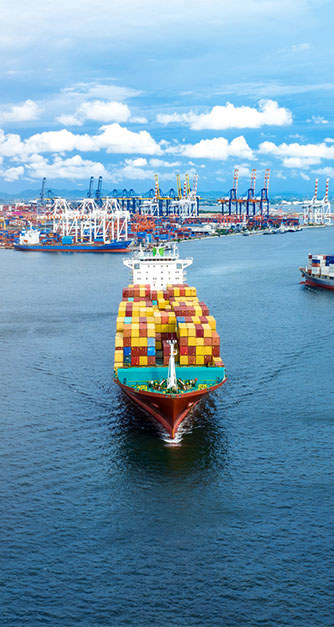 International shipping vessel leaving the port.