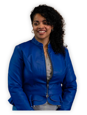 A Trailer Bridge employee smiles at the camera while standing.