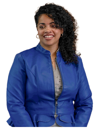 A Trailer Bridge employee smiles at the camera while standing.