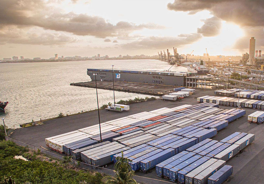 Aerial photo Trailer Bridge barge in Puerto Rico at sunrise. 