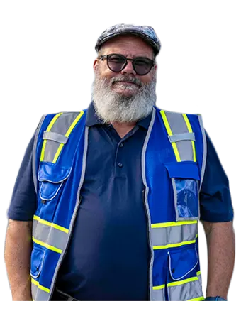 A Trailer Bridge employee wearing a high-visibility jacket smiled at the camera.