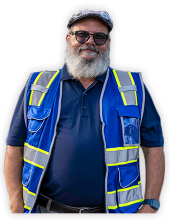 A Trailer Bridge employee wearing a high-visibility jacket smiled at the camera.