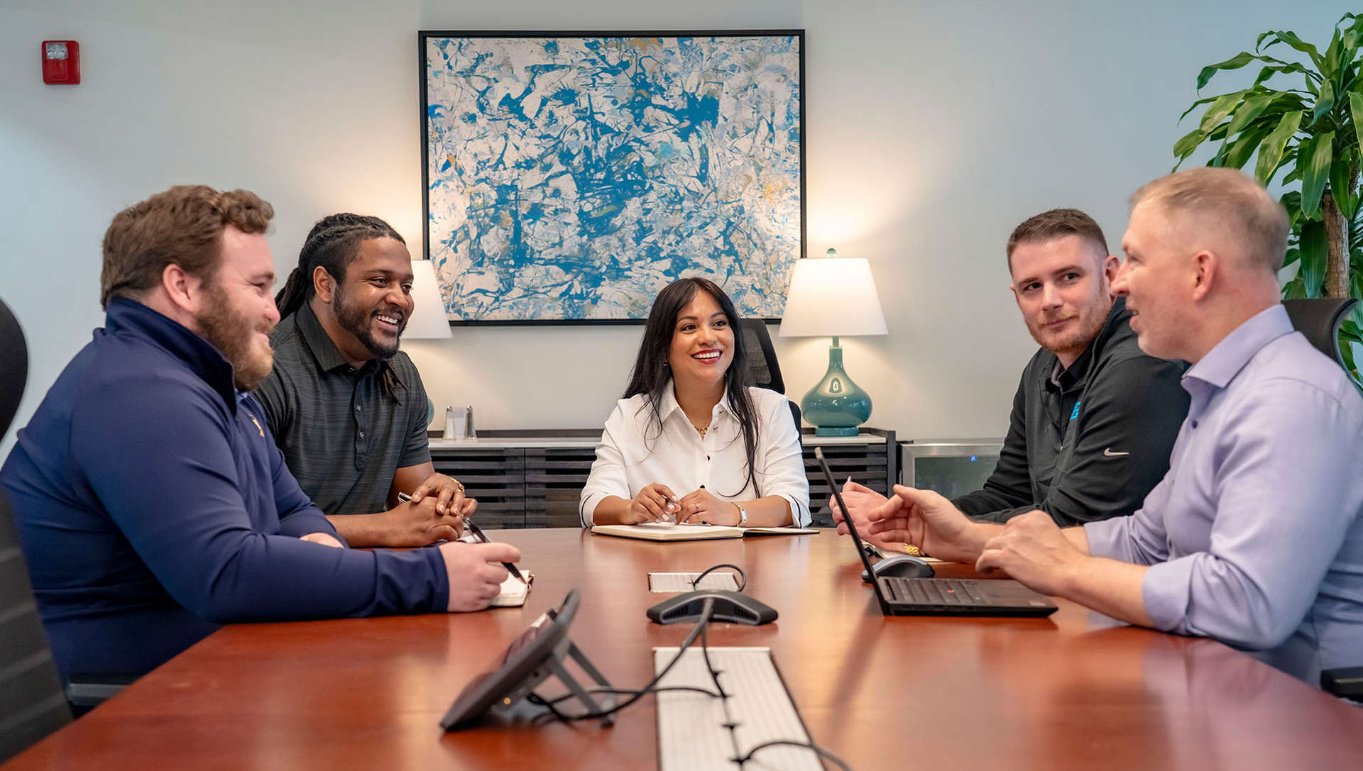 Group of Trailer Bridge employees meeting in a conference room.