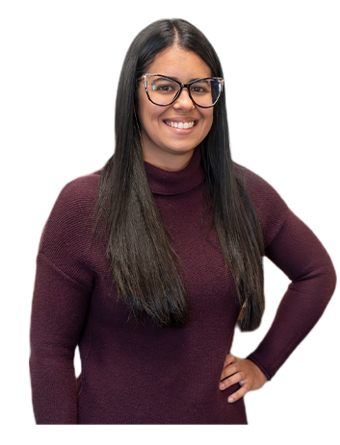A Trailer Bridge employee smiles at the camera while standing.